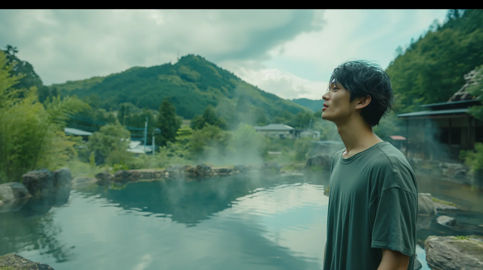 Cinematic hot spring landscape with a young man and mountain village atmosphere